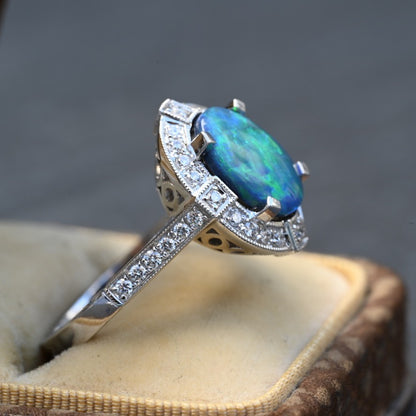 IGI Certified 14K White Gold Ring with Natural Black Opal Surrounded by Diamonds4