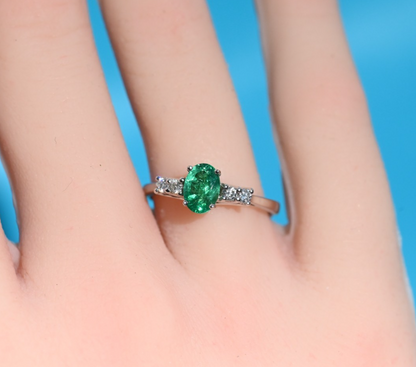 Superb 18K White Gold Ring with Oval Emerald Center Stone and Side Diamonds0