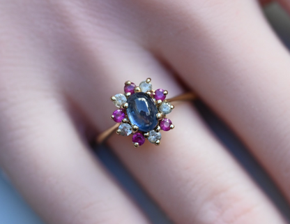 Elegant Antique / Vintage Natural Sapphire Ring with Halo of Rubies in .375 GTV0